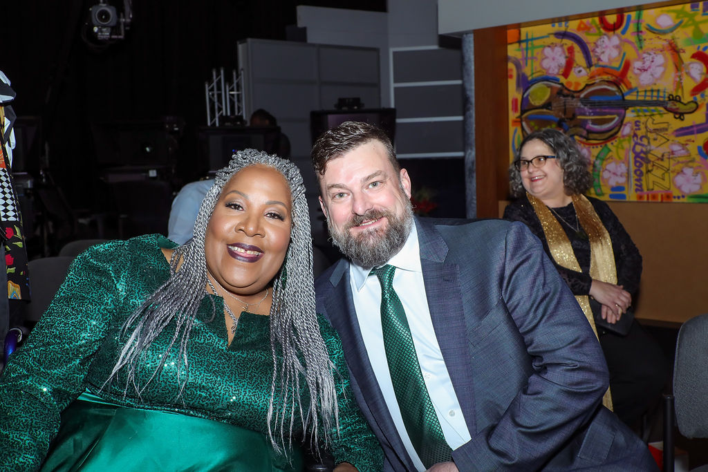 melody-3 Melody Mobley and Chris Gibbons smiling at the camera during the premiere of The Dark White Forest.