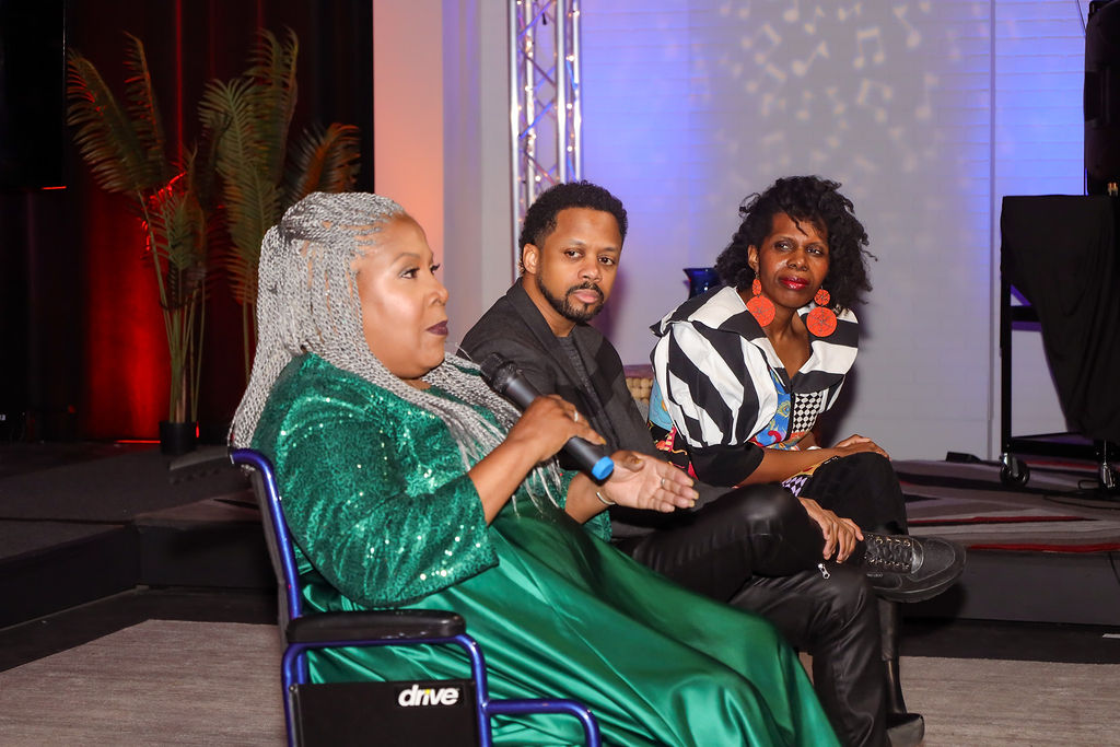 melody-6 Melody Mobley speaking into a mic during the Q&A portion of the premiere of The Dark White Forest.