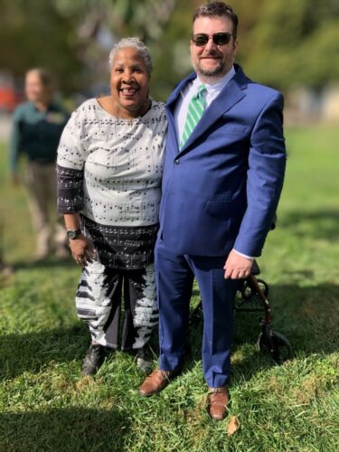 Melody and Chris dressed to the nines and posing for the camera while enjoying a beautiful sunny day.